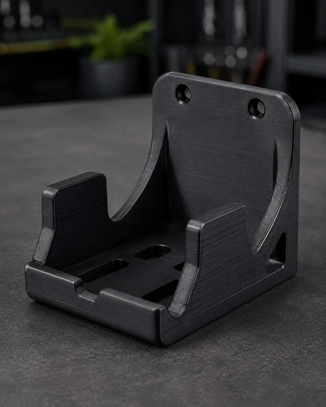 Black 3D printed support bracket with mounting slots and reinforced side walls