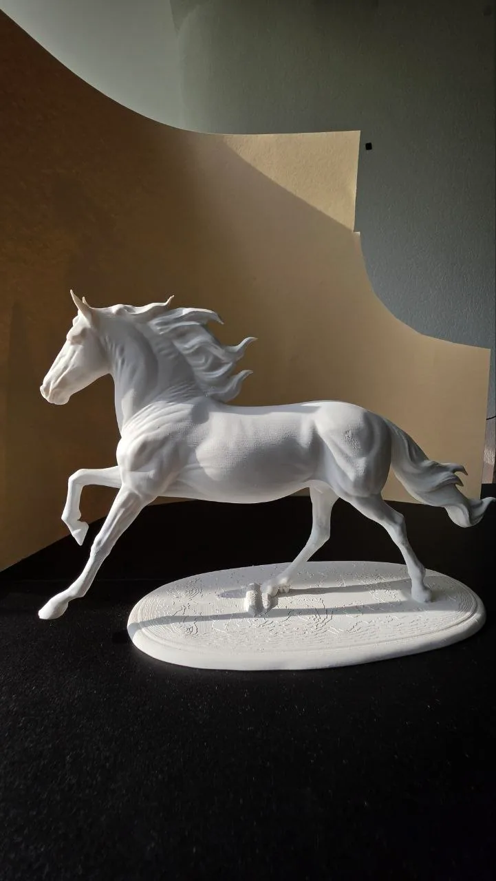 Large white 3D printed sculptural horse model on an oval base